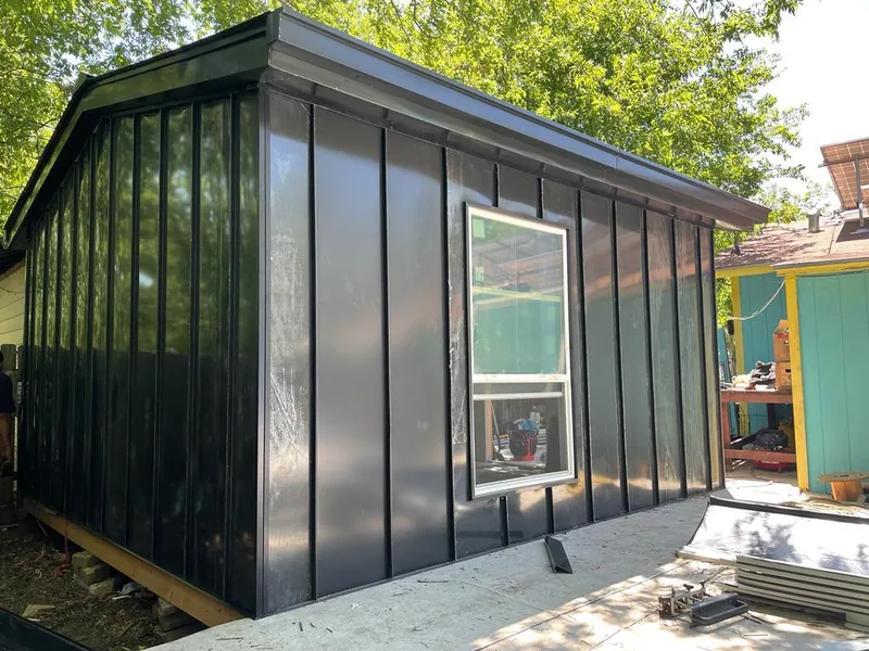 Black standing seam metal wall panels for Roof Inspection in Rio Grande City