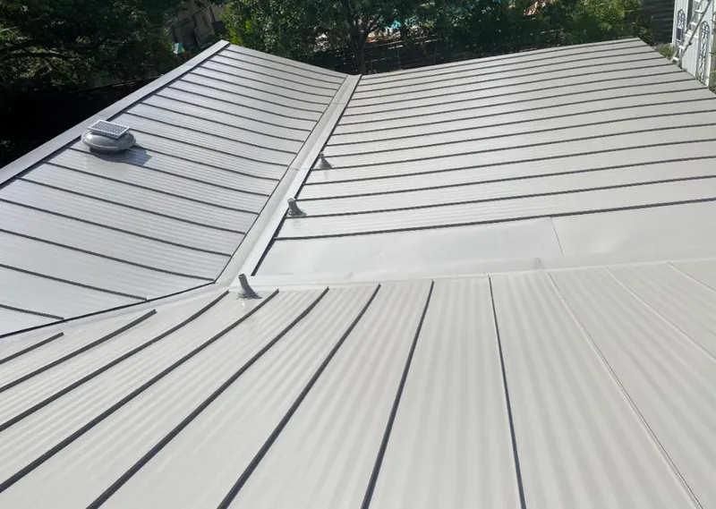 Solar attic fan installed on a metal roof for Roof Ventilation in Rio Grande City